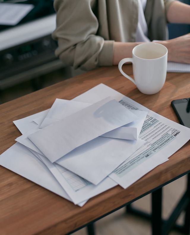 New migrant family reviewing a government letter about tax and Medicare at home in Australia