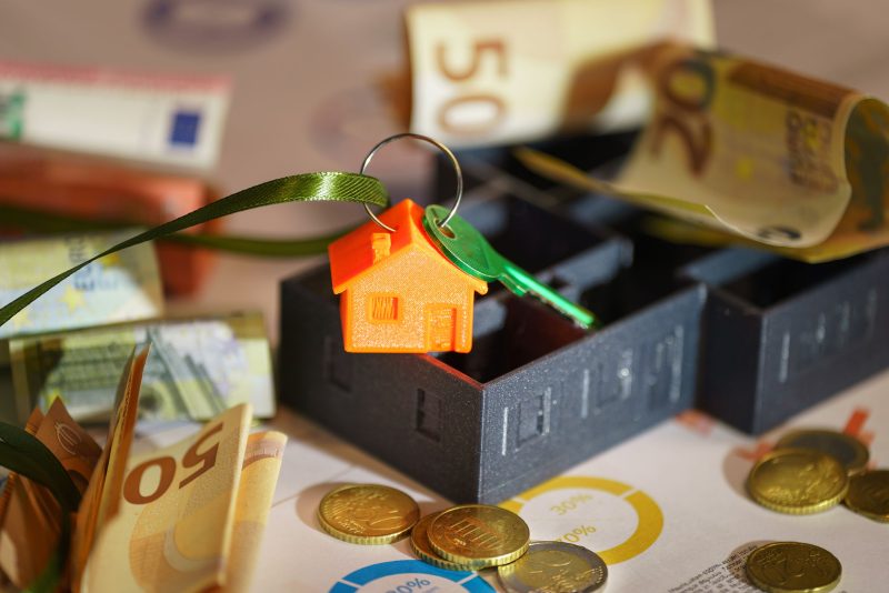 House keys and bank statements representing the rental bond needed in Australia