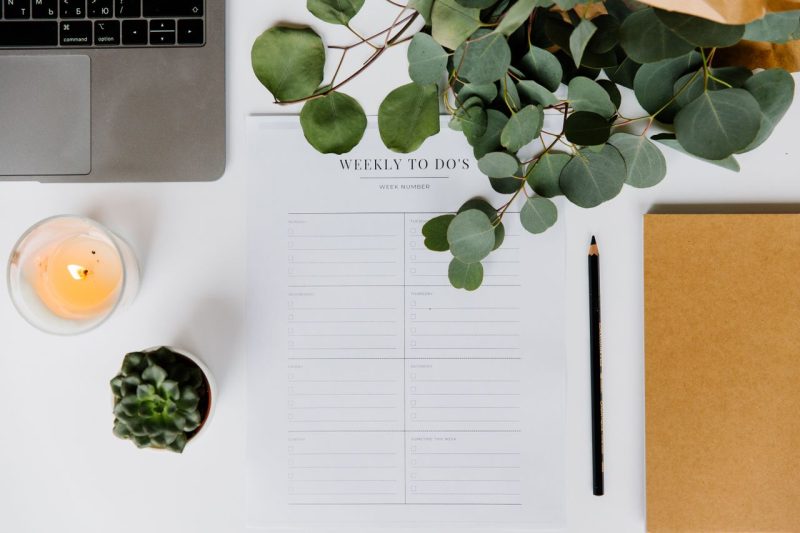 A simple weekly planner or calendar, representing building routine while settling in