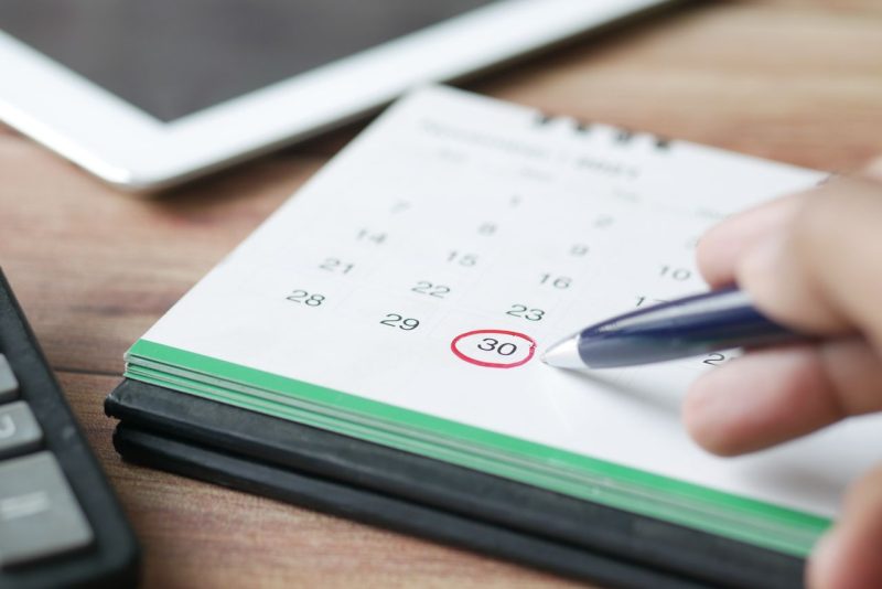 Close-up of a calendar marking bill due dates