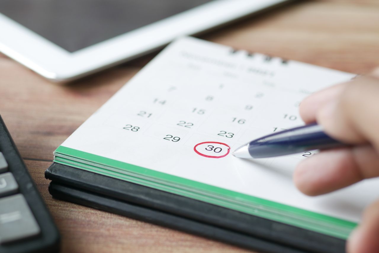 Close-up of a calendar marking bill due dates