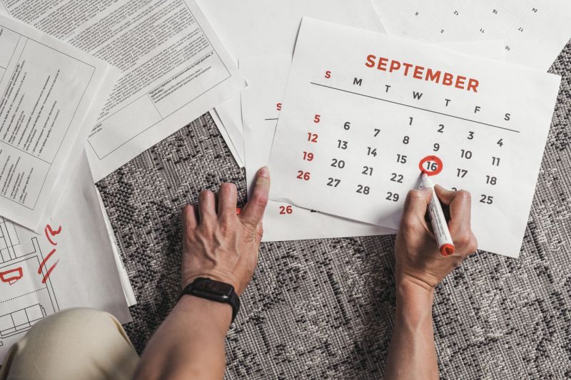 Calendar with a reminder marked for reviewing paperwork