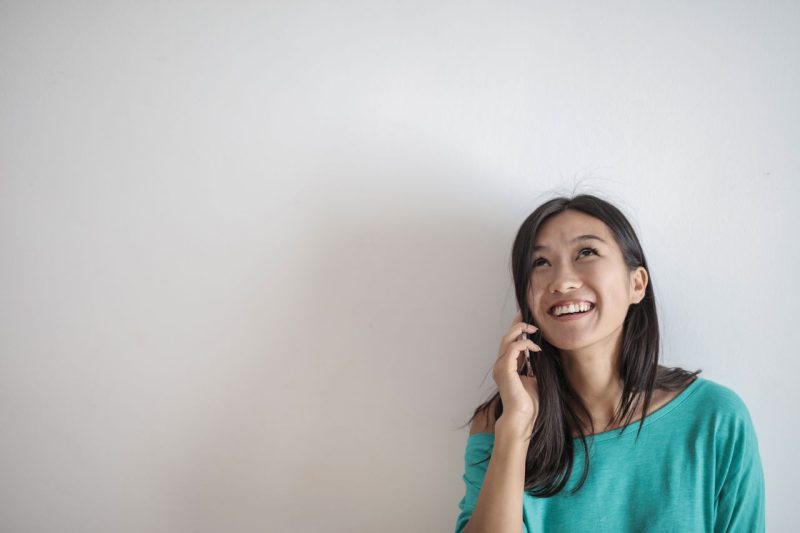 New immigrant taking a phone call about a job offer in Australia