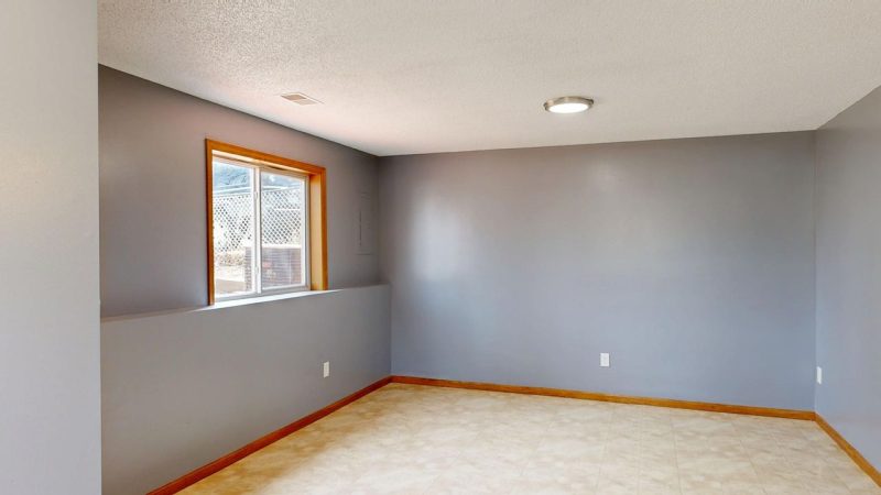 A freshly repainted ceiling in a bright, repaired living room