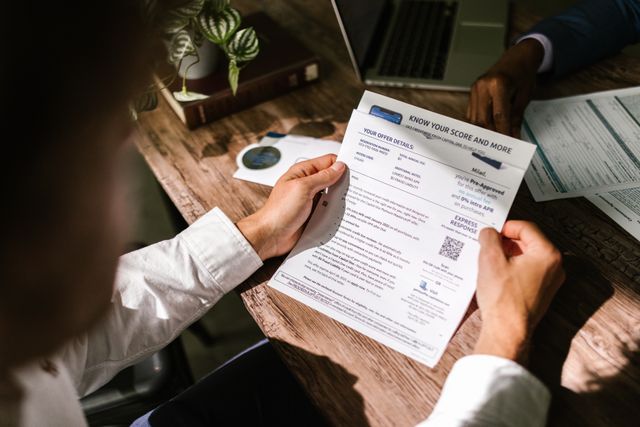 Close-up of a printed credit file report being reviewed