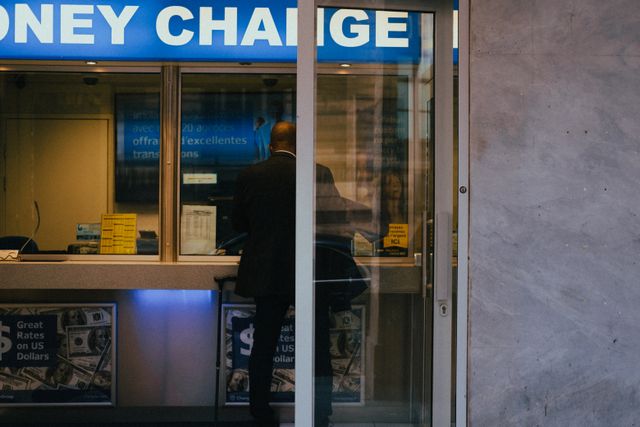 Person comparing exchange rates before sending money overseas from Australia
